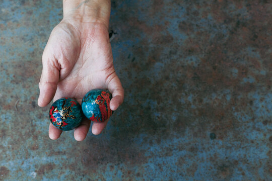 hands of senior adult woman excercising with chinese baoding balls for stress relief and deep relaxation