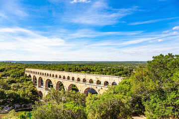 The aqueduct Pont du Gard in forest