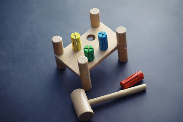 Children's development. Children's wooden toy on the table in the play area. Room of children's creativity and self-development. Wooden constructor.