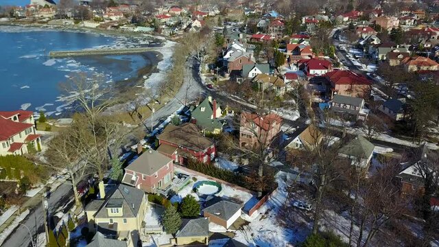 View of Waterfront Homes During the Winter - Reveal Shot