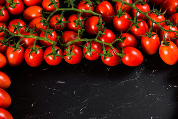 Tomatoes on wood background. Close-up of bio fresh vegetables. Group of summer tomatoes. Space for text top view
