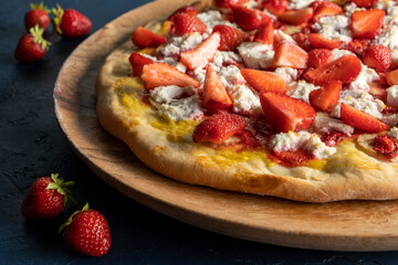 Strawberry and banana pizza with ricotta cheese and mango sauce.