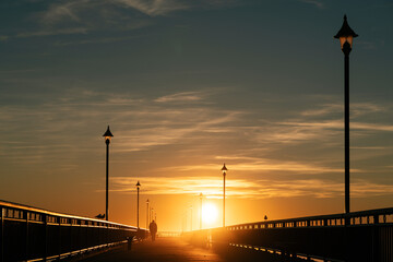 Amazing golden hour sun rays on a pier