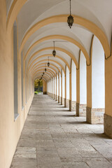 Long street gallery with arches, columns and lanterns