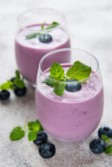 Glasses of blueberry yogurt with blueberries