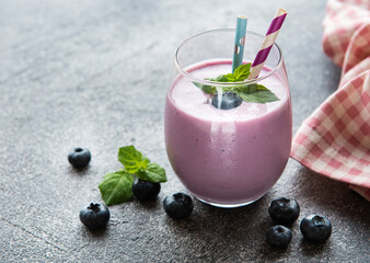 Glass of blueberry yogurt with blueberries