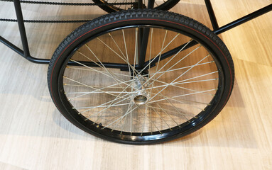 Bicycle wheel with black steel body frame.