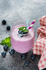 Glass of blueberry yogurt with blueberries