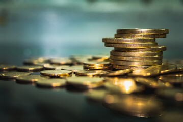 Gold coins stacks is representing riches and wealth management. Coin stack growing and find out the way to get a return on investment. Finance and money exchange investment as concept.