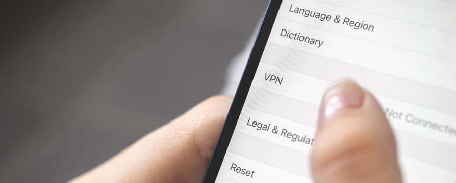 Person turn on the VPN setting on mobile phone, close-up, banner design photo