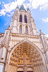 Fototapeta na wymiar Kortrijk, West Flanders, Belgium - church tower and gothic portal