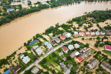 Aerial view of Dnister river with dirty water and  flooded houses in Halych town, western Ukraine.