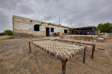 Rural cook making vegetable in traditional hotel called Dhaba on Makran Coastal highway.  mostly truck driver eat food at dhaba
