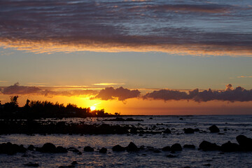 Naklejka na ściany i meble Rocky beach in the north of the island at sunset, Mauritius