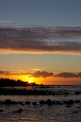 Fototapeta na wymiar Rocky beach in the north of the island at sunset, Mauritius