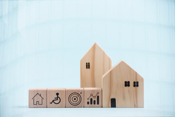 Mini wood house model from model on wood table in the nature background , Planning buy Real Estate, Planning to buy property and Choose the best. work from home and stay at home concept.