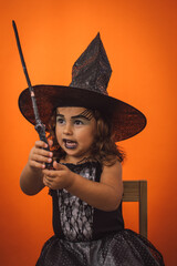 Little girl dressed as a witch for Halloween