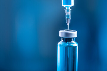 Bottle and syringe of serum drug for injections in lab