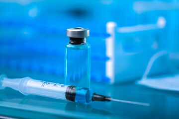 Bottle and syringe of serum drug for injections in lab