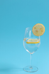 A glass of water with lemon.