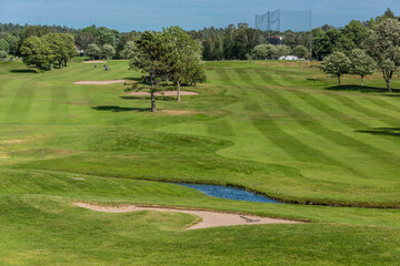 Gothenburg, Sweden - June 13 2021: Golfers at the green at Gothenburg Golf Club.