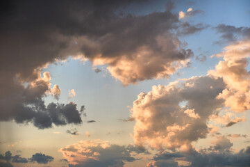 Fototapeta na wymiar Bright landscape of dark clouds on yellow sunset sky in evening.