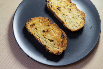 Slice of toasted bread on a plate.