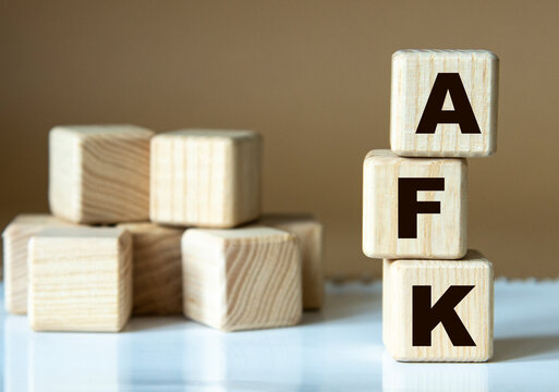AFK - acronym nadrevyannye cubes on a brown background
