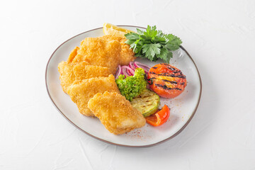 Large chunks of fried fish - pike perch, breaded in breadcrumbs with herbs, red onion, lemon and...
