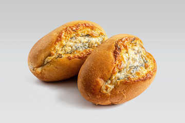 Delicious buns with herbs, garlic and cheese on white