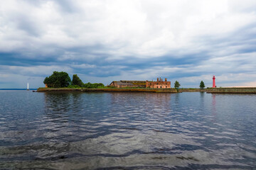 Sea fortress, fort in Kronstadt, Russia. Fort Kronshlot in the Gulf of Finland. Dramatic clouds and sky, huge storm clouds over sea