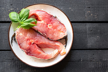 raw fish carp white fresh headless  freshwater fish seafood meal snack on the table copy space food...