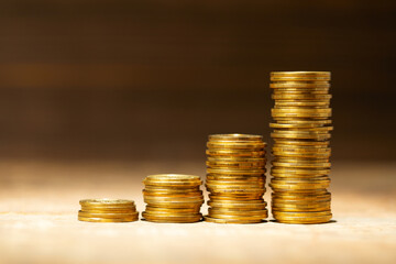 Stack of coins with steps down as a symbol of success