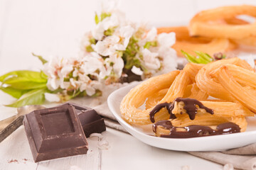 Churros with chocolate dipping sauce.