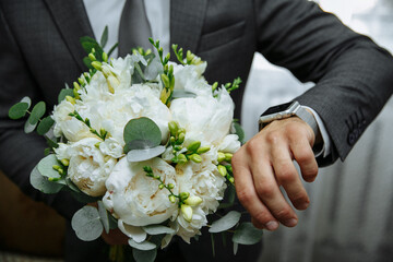 bride and groom holding hands