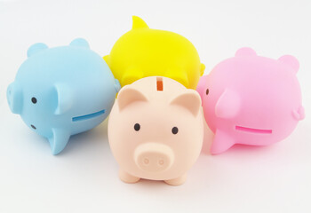 Stability and bankruptcy of savings funds concept. Many piggy banks laying and one standing close...