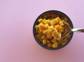 Canned seed of sewet corns top view on color background, metal tin 