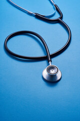 Fototapeta na wymiar medical equipment stethoscope on blue background