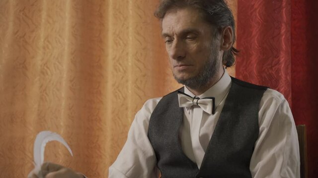 The man in the suit of President Abraham Lincoln portrait