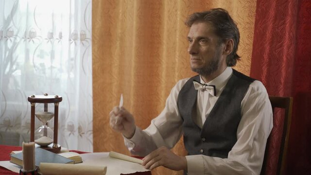 The man in the suit of President Abraham Lincoln portrait