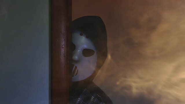 Man with hockey mask and spooky atmosphere with fog and light