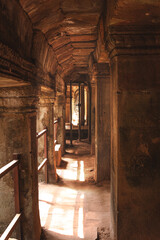 Fototapeta na wymiar An ancient passage made from stone in Angkor wat