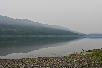 Putorana Plateau. Fog on a mountain lake.