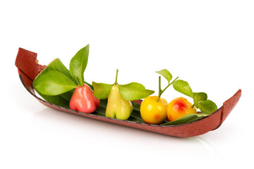 Deletable imitation fruits or kanom look choup thai name isolated on white surface.