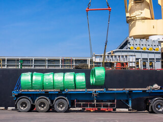 The vessel discharging steel wire rods on truck at industrial port of thailand.