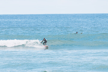Surfer on a small left, les casernes beach, seignosse, landes, france