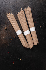 soba raw buckwheat noodles ready to cook portion meal snack on the table copy space food background rustic 