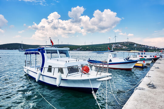Traditional fishing boats moored at the harbor in Seferihisar, Izmir, Turkey
