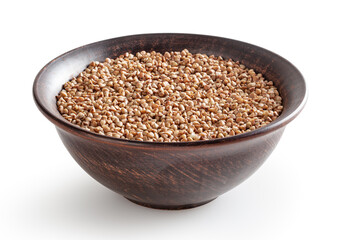 Uncooked roasted buckwheat in ceramic bowl isolated on white background with clipping path