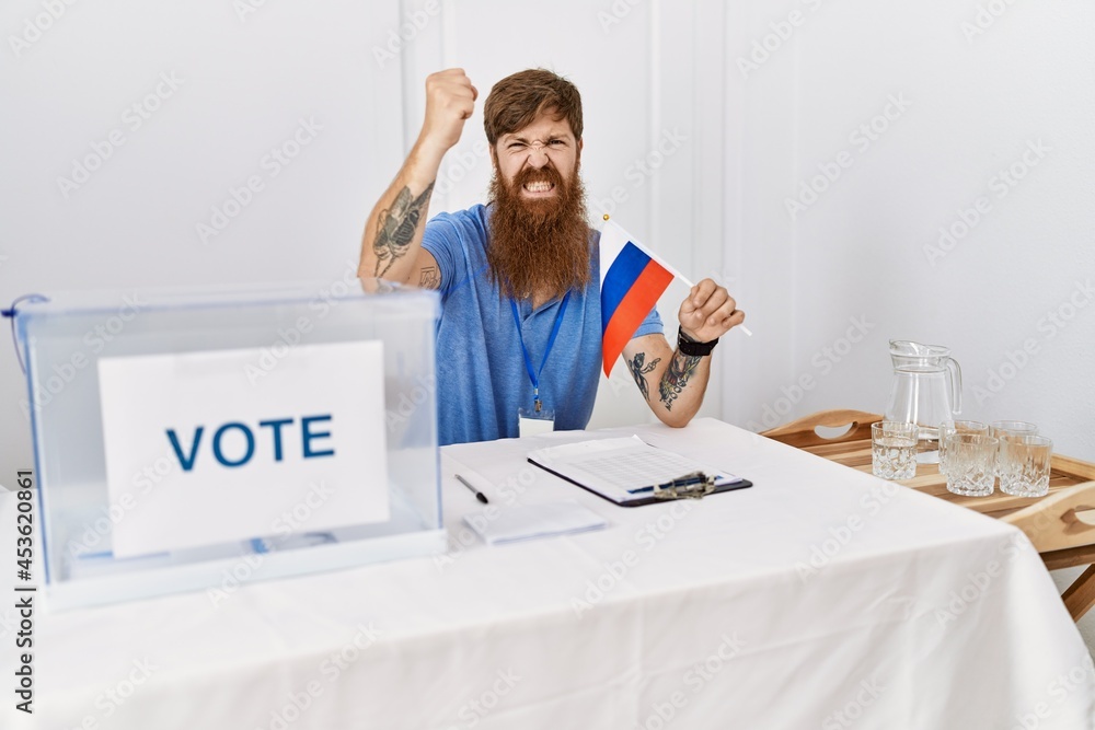 Canvas Prints Caucasian man with long beard at political campaign election holding russia flag annoyed and frustrated shouting with anger, yelling crazy with anger and hand raised